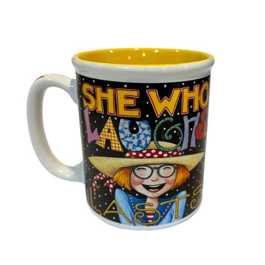 "She Who Laughs Lasts" Mary Engelbreit Coffee Mug